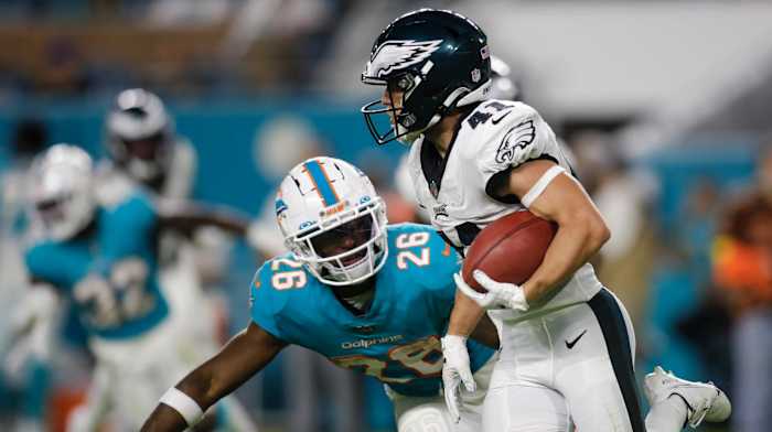 Philadelphia Eagles wide receiver Britain Covey (41) runs with the football ahead of Miami Dolphins running back Salvon Ahmed (26) during the fourth quarter at Hard Rock Stadium.